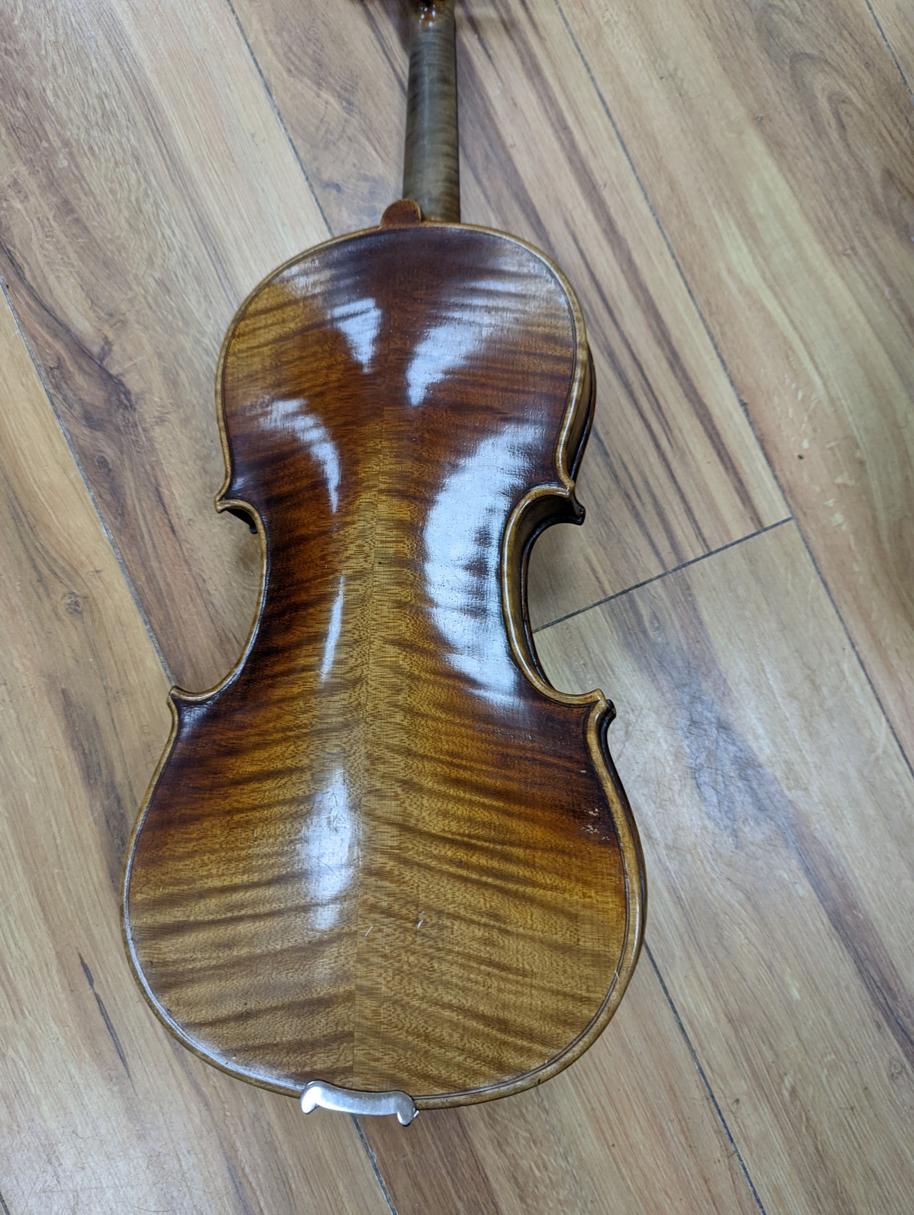 A late 19th century German violin, case, 60 cms long.